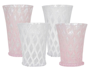 The Juliska Trellis Drinkware Collection includes four similarly sized, diamond-patterned lemonade glasses—two clear and two light pink—elegantly arranged for a stylish presentation.