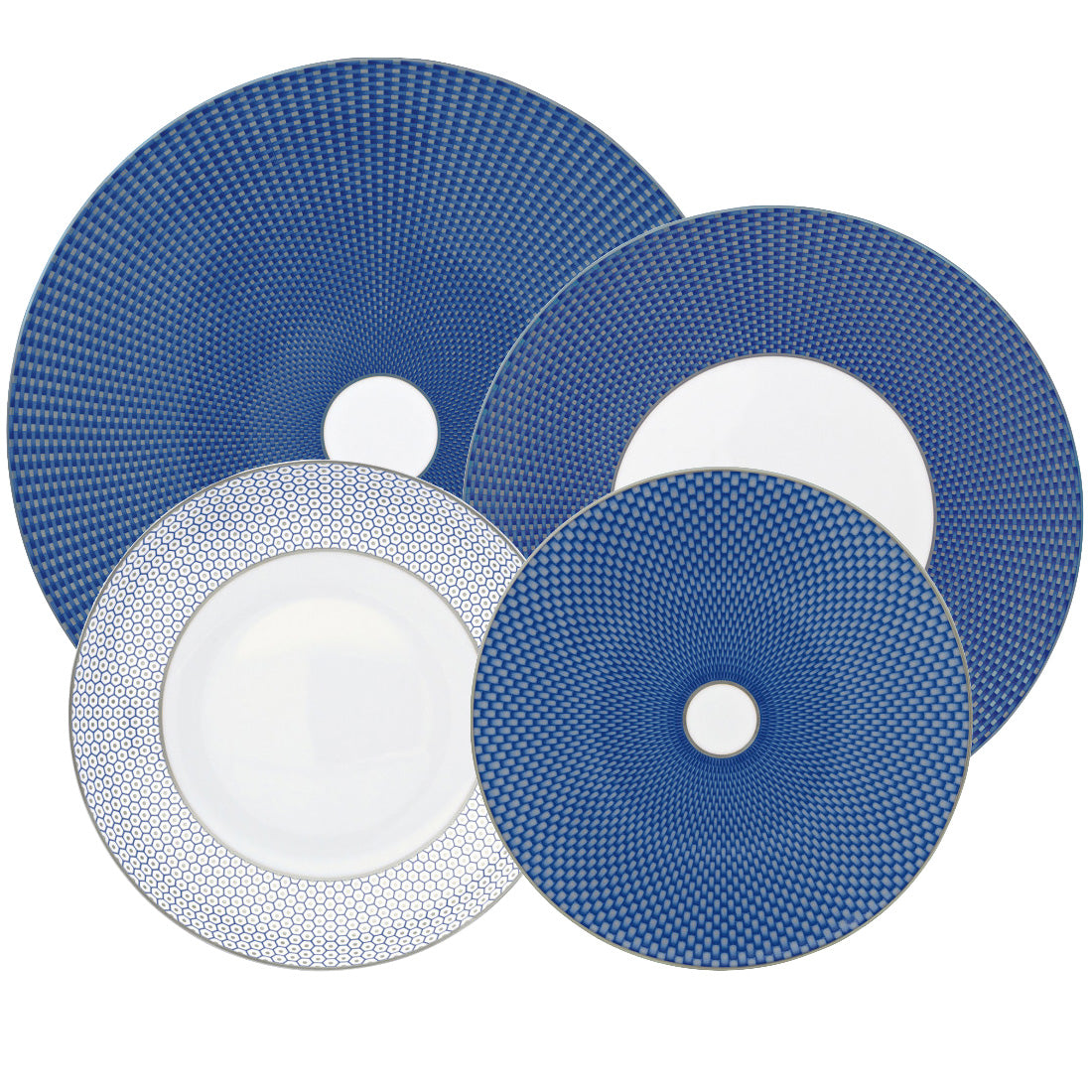 Four Tresor Blue Dinnerware Collection porcelain plates by Raynaud, featuring blue and white geometric patterns, are arranged overlapping on a white background.