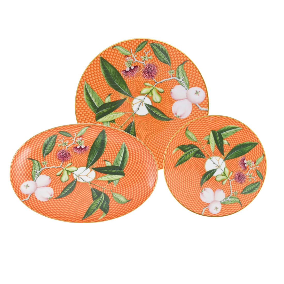 Three porcelain plates from the Tresor Fleuri Orange Dinnerware Collection by Raynaud feature a botanical design with hand-painted orange patterns, green leaves, and white flowers, artfully overlapped.