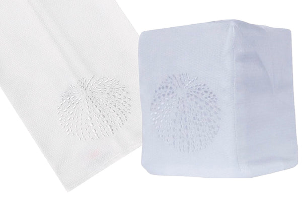 Two Sea Urchin Collection, White handkerchiefs on a white background, one is flat and made of Italian linen with a hand embroidered design, the other is folded displaying a similar pattern by Haute Home.