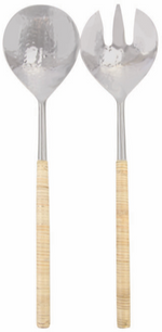 Two elegant serving utensils—the Aquila Serving Collection by Be Home—feature hammered metal bowls and light, textured handles. Handcrafted in India, the set includes an upright spoon and fork displayed side by side.