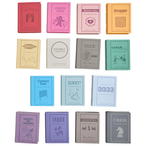Fifteen WS Game Company Vintage Bookshelf Board Games are arranged in three rows, each with a fabric cover styled after classics like Monopoly, Scrabble, Clue, Life, Boggle, Sorry!, and Chess.