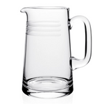 The Madison Pitcher by William Yeoward Crystal features a clear design with a handle and three horizontal frosted stripes near the top, displayed on a white background.