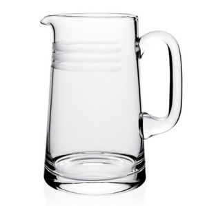 The Madison Pitcher by William Yeoward Crystal features a clear design with a handle and three horizontal frosted stripes near the top, displayed on a white background.