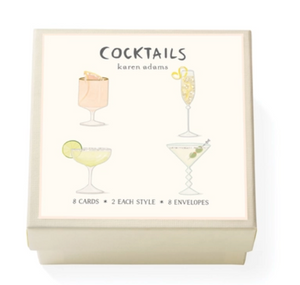 The Cocktails Gift Enclosure Set by Karen Adams features a cream box with an illustrated label of four cocktails and includes 8 hand-glittered cards (2 per style) plus envelopes—a perfect gift addition.