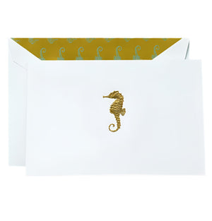 Send your notes in style with Crane’s Gold Seahorse Classic Card Set, featuring white cotton paper envelopes, gold engraved seahorses, and a yellow inner lining with a repeating seahorse pattern.