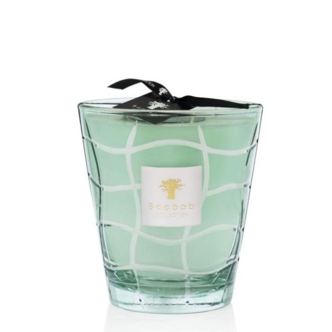 Empty Baobab Waves Nazare Candle glass with a light green hue and a black ribbon, isolated on a white background, previously infused with peppermint.