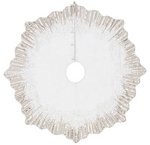 The Kim Seybert Gilded Spray Tree Skirt is round, white, and features scalloped edges with a sunburst of sequined beams plus three side closures—a dazzling, elegant accent for your Christmas decor.