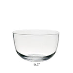 The Whitney Deep Bowl from William Yeoward Crystal is a clear, rounded glass serving bowl displayed on a white background. Ideal as a centrepiece, this elegant bowl measures 9.5 inches in diameter.
