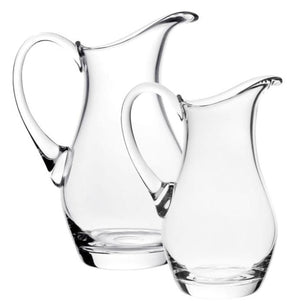 The Whitney Pitcher Collection by William Yeoward Crystal features two crystal pitchers of varying sizes, shown side by side on a white background—a perfect handmade jug set for a thoughtful wedding gift.