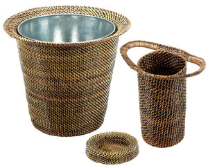 The Calaisio Rattan Wine Collection features three handmade pieces— a large basket with metal interior, a tall handled basket, and a small round tray—showcasing artisanal craftsmanship in warm brown tones.