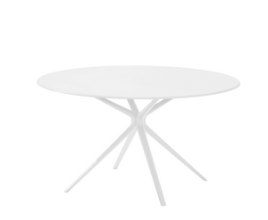 The Moai Outdoor Round Dining Table by Janus et Cie features a smooth white surface and four angled legs converging at the center, making it perfect for outdoor gatherings.