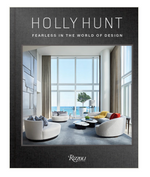 Book cover for Holly Hunt: Fearless In The World of Design by Rizzoli, featuring a sleek modern living room with large windows, contemporary furniture, and an ocean view—highlighting elegant American-inspired interiors.