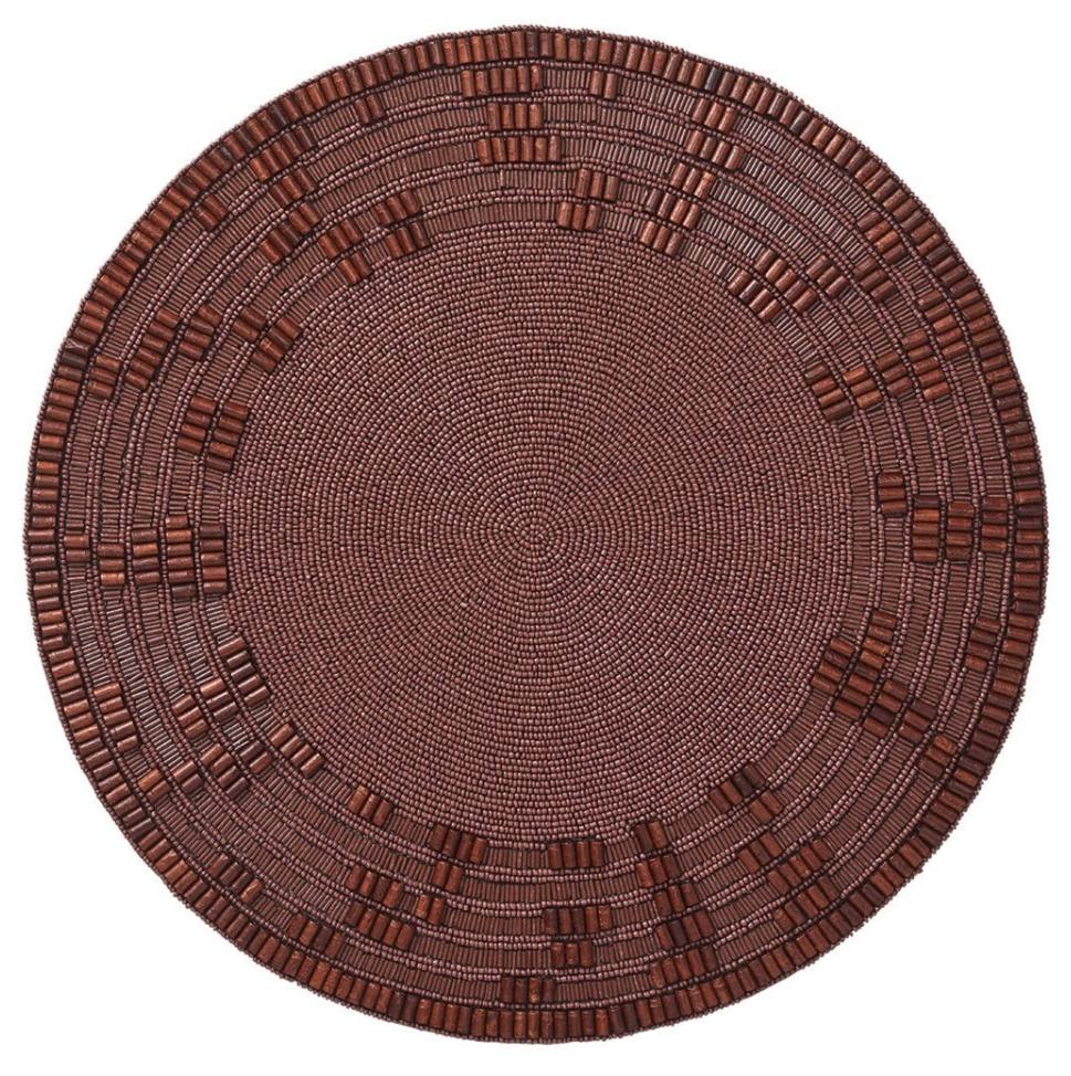 The Kim Seybert Wood Matrix Placemat features a round brown design with handcrafted geometric patterns made from wooden beads along the edges, creating an artisanal beaded texture.