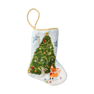 The Bauble Stockings Woodland Creatures Needle Point Stocking features a hand-stitched decorated tree, woodland animals, snowy details, and a gold hanging loop—an enchanting addition to your holiday décor.