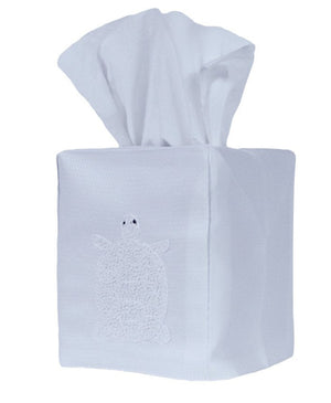 The Huck Turtle Tissue Box Cover by Haute Home is hand-embroidered on fine Italian linen and showcases a charming turtle design, stylishly concealing your tissue box while enhancing your decor.