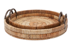 The Royston Round Tray Collection by Made Goods features two nested round rattan trays with hammered iron handles, displayed together against a white background for a natural, organic look.