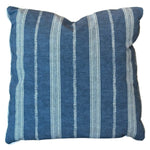 The Orlando Stripe Outdoor Pillow by Associated Design features blue fabric with vertical white stripes, a visible textured finish, and a slightly indented top center seam, crafted from premium materials for luxurious comfort.