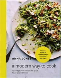 Cover of "A Modern Way to Cook" from Penguin Random House, showing spiralized zucchini noodles with cheese and garnishes—highlighting fast, vegetable-focused meals against a light backdrop.