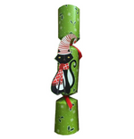 The Caspari Yule Cat Pet Christmas Cracker features green paper with white snowflakes and holly, plus a die-cut appliqué of a black cat in a red scarf and striped hat at the center.