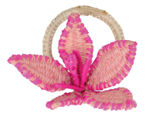 The Mercedes Salazar Flower Napkin Ring features three large petals crafted from woven pink and beige raffia with a circular handle—perfect as a decorative accent for summer gatherings.