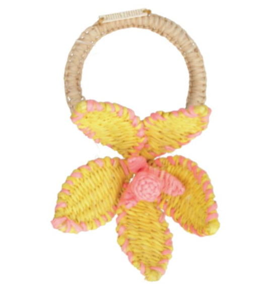 The Mercedes Salazar Flower Napkin Ring features a woven raffia ring with a textured yellow and pink five-petal flower—ideal for summer gatherings.