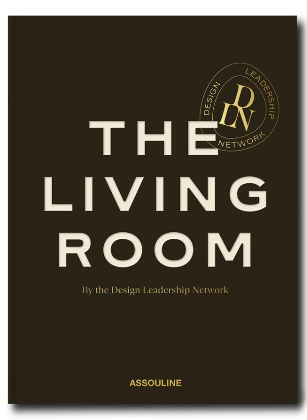 The Living Room" by Assouline features a gold DLN seal on a dark cover and celebrates modern living rooms with stunning interior photography.