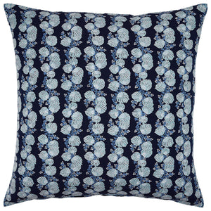 The Mahin Indigo Pillow by John Robshaw is a square cushion made from a linen-cotton blend, showcasing an indigo background with a repeating pattern of azure and white floral designs.