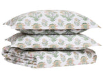 The Hina Duvet bedding set by John Robshaw includes a floral duvet and two pillowcases, all made from organic cotton with a green and pink floral pattern on a white background.