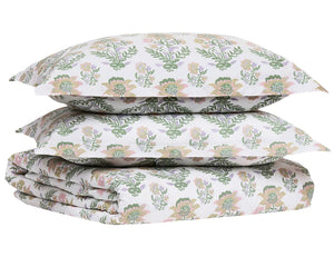 The Hina Duvet bedding set by John Robshaw includes a floral duvet and two pillowcases, all made from organic cotton with a green and pink floral pattern on a white background.
