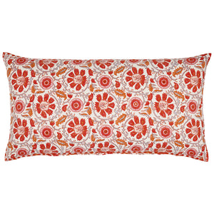 The Yavi Coral Bolster by John Robshaw is a rectangular pillow with a white background, showcasing red and orange flowering vines and leaves, beautifully hand block printed for a charming touch.