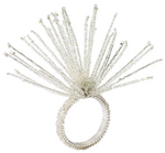 The Kim Seybert Spider Bead Burst Crystal/Silver Napkin Ring features elongated silver beads radiating outward, creating an eye-catching accent for your dining table.