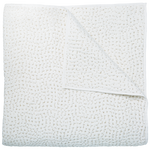 The John Robshaw Stitched Sand Coverlet is a white cotton voile quilt featuring a subtle stitched pattern, crafted in India and shown neatly folded with one corner turned down to reveal the reverse.