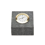 The Marle Cool Grey Square Clock by Pigeon & Poodle features faux shagreen and a gold-trimmed round face showing 8:20, set against a plain white background.