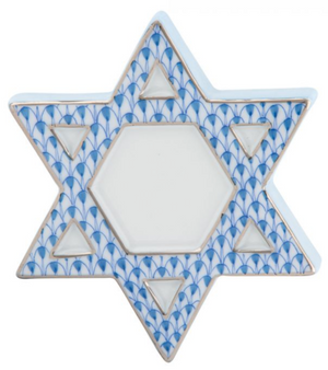 The Herend Star of David, Blue features a hand-painted blue and white pattern with a central hexagon and triangles at each point, combining charm and durability in a ceramic piece.
