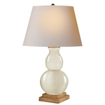 Visual Comfort's Small Gourd Form Table Lamp in Tea Stain with Natural Paper Shade with a dual-sphere ceramic base of increased height, set on a wooden platform.