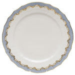 The Herend Fish Scale Service Plate in Light Blue features a scalloped edge and hand-painted blue and gold designs around the rim, making it perfect for those with artistic appreciation.
