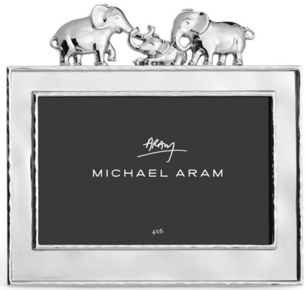 A Michael Aram Elephant Frame with elephants on top, perfect for showcasing cherished memories.