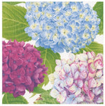 Caspari's Hydrangea Garden Blue Cocktail Napkins feature beautifully printed blue, pink, and white hydrangea clusters with green leaves on eco-friendly triple-ply napkins—perfect for stylish entertaining.