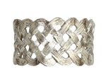The Braid Napkin Jewels Platinum Set by L'Objet features a handcrafted, textured braided design in platinum—an elegant statement for any table and perfect for gifting in a luxury box.