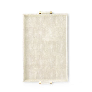 The Aerin Classic Shagreen Butler Tray in cream features a rectangular shape, textured surface, and two brass-accented handles, shown from above on a white background.