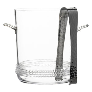 The Juliska Dean Ice Bucket with Tongs is a clear, mouth-blown glass ice bucket with a textured rope base, two side handles, and includes metal tongs that rest inside.