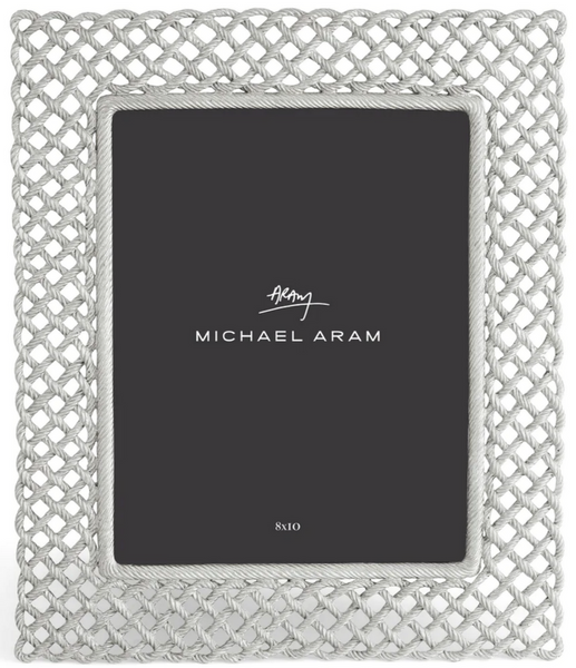 Sentence with replaced product:
Michael Aram's Love Knot Collection Michael Love Knot Frame Silver, 8” x 10”, features a textured woven border design that symbolizes the strength of togetherness, displaying a placeholder labeled "8x10".