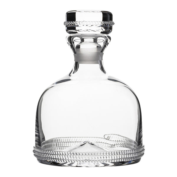 Empty Juliska Dean Decanter with a detailed pattern on the base and an ornate stopper, isolated on a white background.