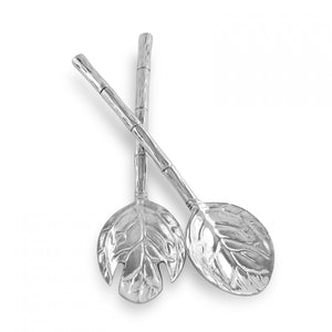 The Beatriz Ball Garden Salad Servers, featuring detailed leaf heads and hammered branch handles, are crossed against a white background.