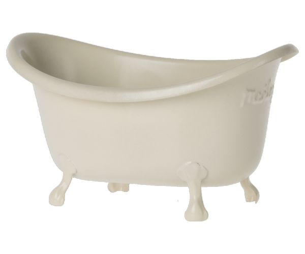 A vintage white plastic Maileg bathtub perfect for Maileg's little mice, set against a black background.