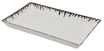 The Pigeon & Poodle Rio Silver and White Tray is a rectangular porcelain tray with raised edges, dark decorative pattern, and a subtle metallic silver drip along the rim.