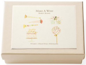 The Karen Adams Make A Wish Card Set features a cream box with hand-embellished party illustrations and includes 8 note cards and 8 envelopes—making it an ideal, charming gift set.