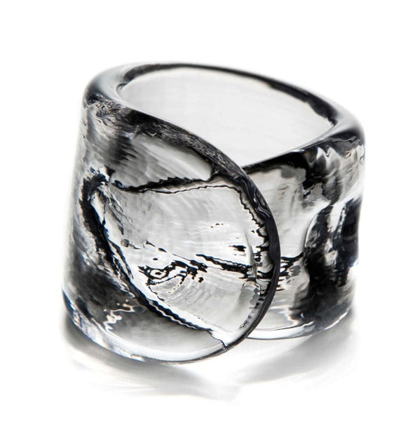 An elegant Simon Pearce Ascutney Napkin Ring with a swirl pattern.
