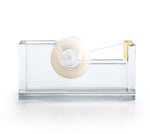 A Russell & Hazel Acrylic tape dispenser with gold-toned hardware on a white surface.